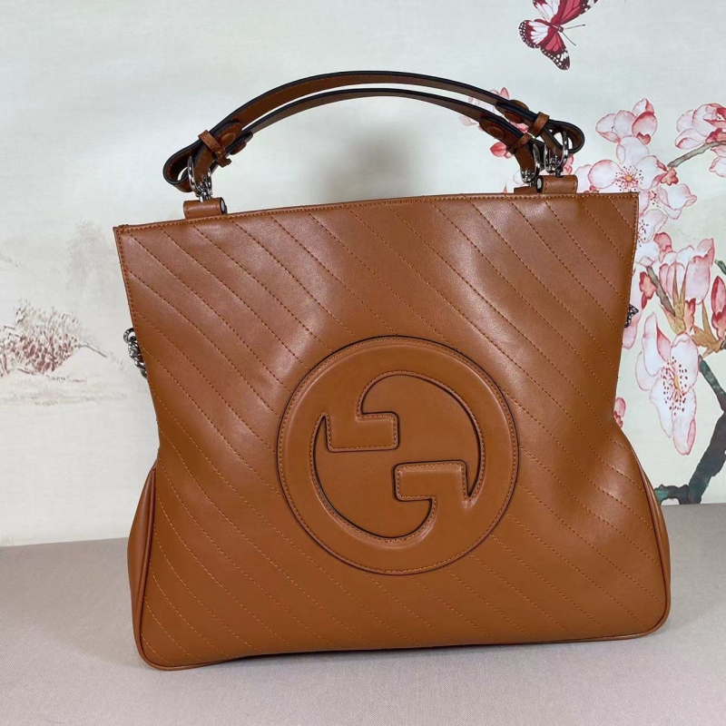 G*u*i top handle bags